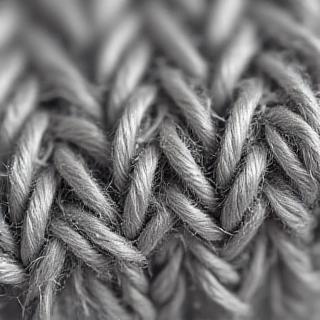 Extreme close-up macro view of woven fabric showing a mispick defect